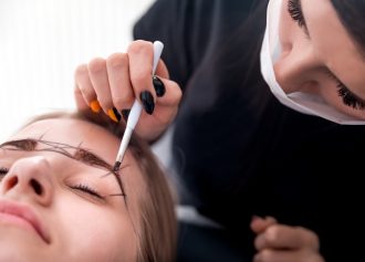 Permanent make up on eyebrows at beauty salon